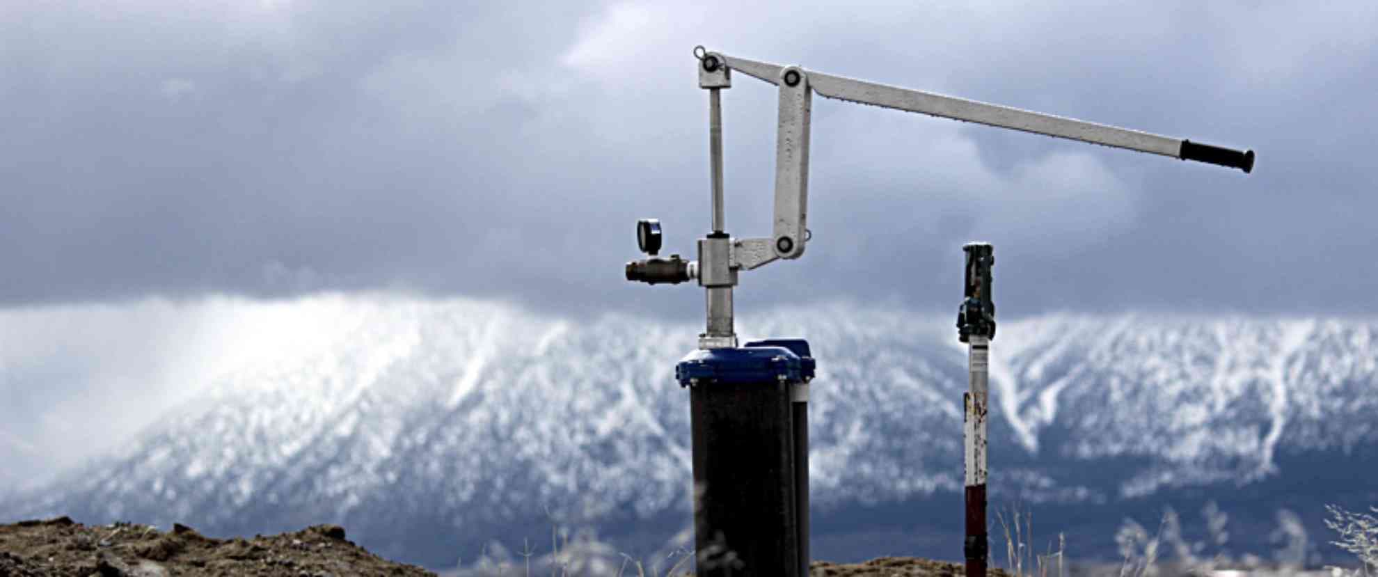 Simple Pump installed on a homestead property with mountains in the background